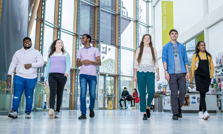 group of new students walking through the Herbert museum