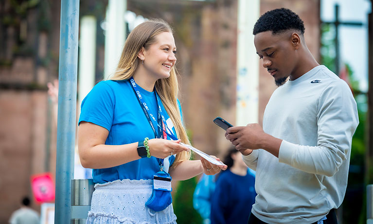 A Students' Union rep helping a student.