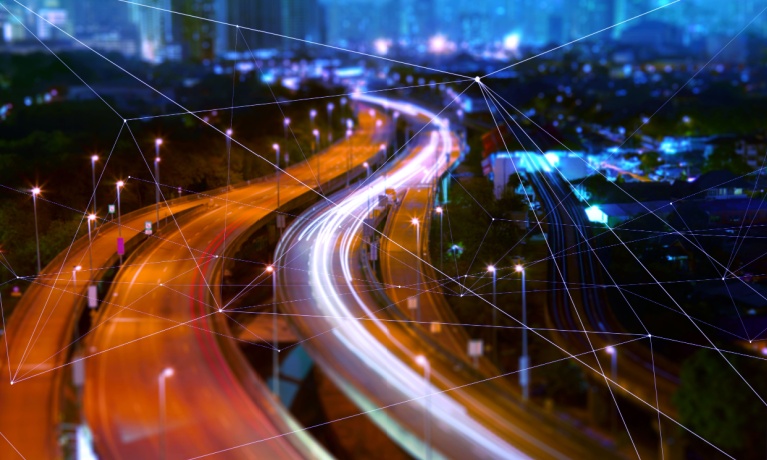 blurred transport lights in a bright night time city